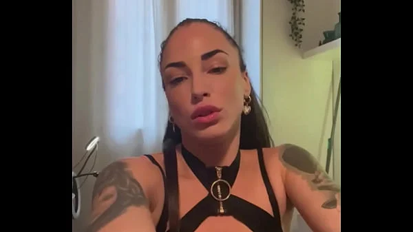 Tattooed brunette in leather lingerie does sexy dance, and has an orgasm while masturbating with a dildo