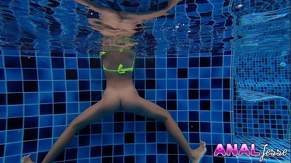 Asian Girl Swims with Big Butt Plug